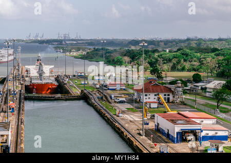 Panama City, Panama - February 20, 2015: Oil tanker ship entering the Miraflores Locks in the Panama Canal, Ships are raised above sea. Stock Photo