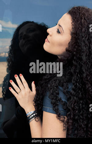 Brazilian folk musician and singer Rosana posing with reflection in a window Stock Photo