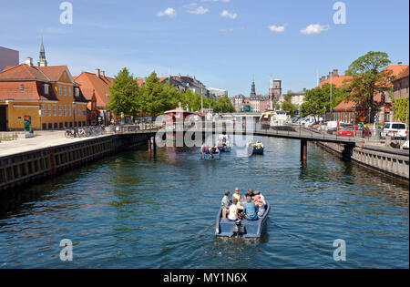 Electric Goboat picnic tour boats in Frederiksholm Canal in Copenhagen, Denmark. Pedestrian bridge and further away the Prince's Bridge, Prinsens Bro. Stock Photo