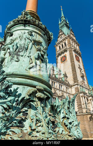 Ornate column and Rathaus City Hall Hamburg Germany Stock Photo