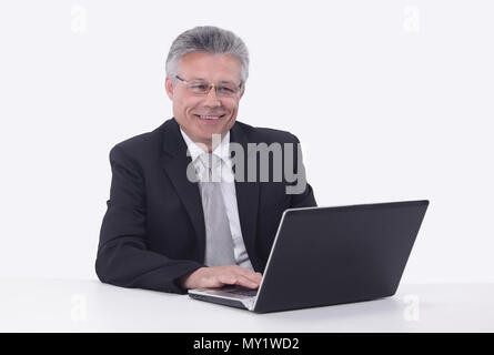 elderly businessman working on a laptop. Stock Photo