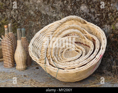 Empty hand made wicker basket with different sizes in  the background. Stock Photo