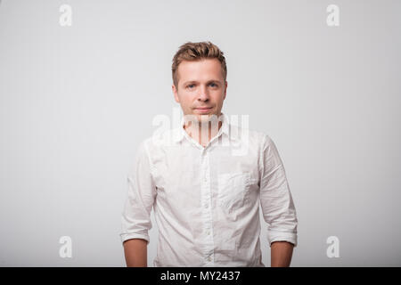 Portrait of a smiling man in white shirt Stock Photo
