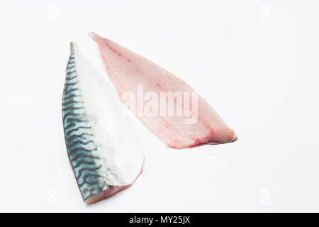 A pair of fresh, raw mackerel fillets on a white background from a mackerel caught from Chesil beach in Dorset on rod and line. Picture shows  skin si Stock Photo