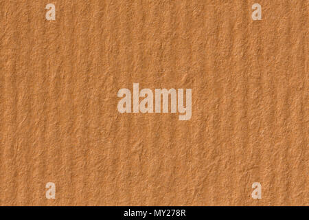 Textured striped packaging recycled orange paper for background. Stock Photo