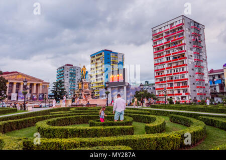Batumi, Georgia - August 25, 2017: Family playing in Europe square garden in Batumi in late afternoon. Stock Photo