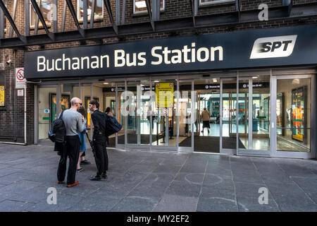 Signed entrance to Buchanan Bus Station, the main bus terminal in Glasgow, Scotland, UK, People standing talking, passengers, open doors. Stock Photo