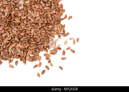 Flax seeds scattered on white background close-up, top view Stock Photo