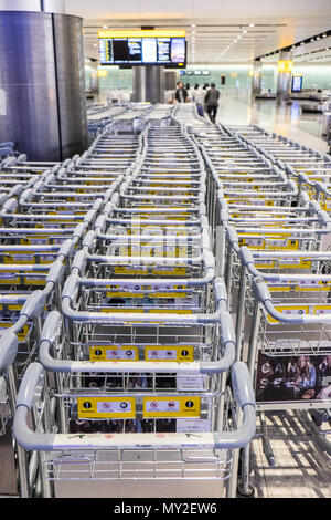 Lines,of,free,trolleys,trolley,luggage,bags,bag,at,arrival,terminal,two,building,Heathrow,Airport,London,England,UK,GB,English,British,transport,hub, Stock Photo