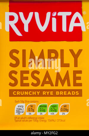 Ryvita Simply Sesame crunchy rye breads nutritional information reference intake traffic lights system colour coded label on packet Stock Photo