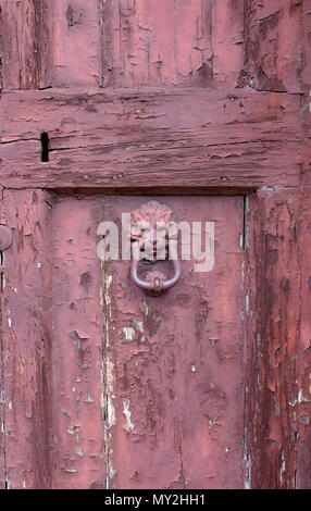 old weathered red painted door, venice, italy Stock Photo