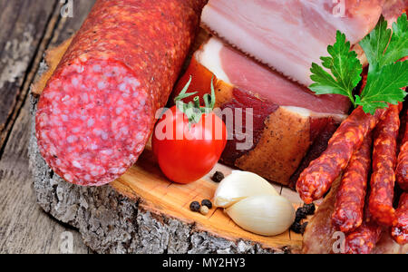 Close up of sausages on a vintage wood table Stock Photo