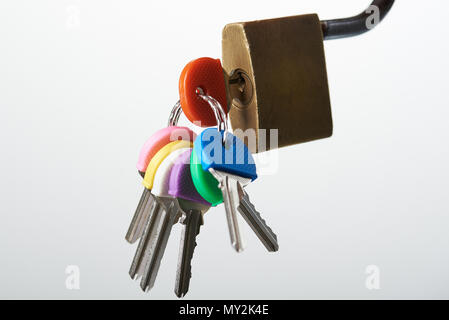 Key inserted into lock isolated on white background close-up Stock Photo