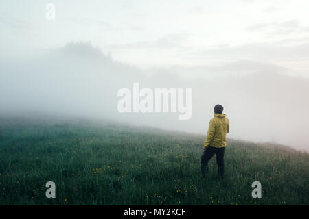 Alone tourist in yellow jacket Stock Photo
