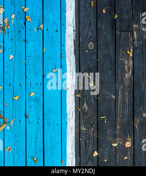 Vintage wooden dark wood, half painted in blue. Front view with copy space. The vertical boards. Background for design. wooden background. Autumn Stock Photo