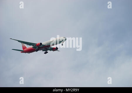Sochi, Russia-October 11, 2016: The plane of the Russian airline flying in the blue sky under the clouds. Stock Photo
