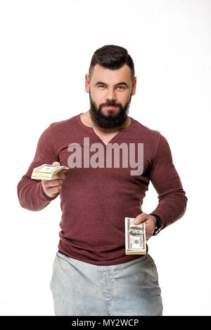 stylish young male photographer with retro camera takes photos on white background Stock Photo