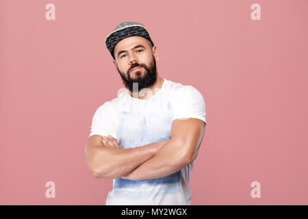 portrait of handsome bearded man in cap looking at camera Stock Photo
