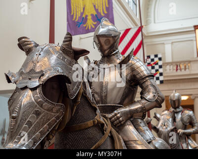 A mannequin of of a knight and a model of horse covered in 15th century plate armor Stock Photo