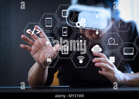 Coding software developer work with augmented reality dashboard computer icons of scrum agile development and code fork and versioning with responsive Stock Photo
