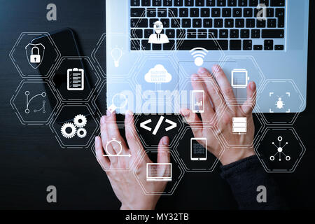 Coding software developer work with augmented reality dashboard computer icons of scrum agile development and code fork and versioning with responsive Stock Photo
