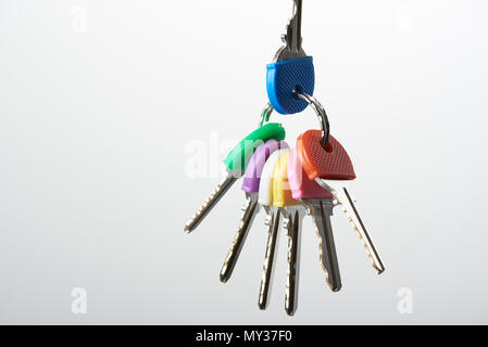 Set of colorful keys on ring isolated on white background Stock Photo