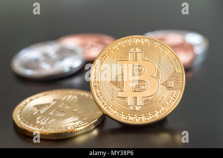 Cryptocurrency Bitcoin metallic coins over grey background Stock Photo