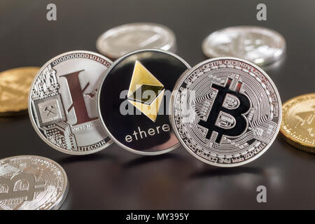 Montreal, CA - 28 May 2018:  Bitcoin, Ethereum and Litecoin crypto currency metallic coins Stock Photo
