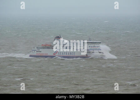 Sea France cross channel ferry struggling in bad weather in English Channel. Waves crashing over the front. Heavy swell approaching Dover, Kent, UK Stock Photo