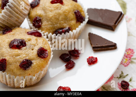 Platter of homemade vegan pumpkin muffins with chocolate and dried cherries. breakfast Stock Photo