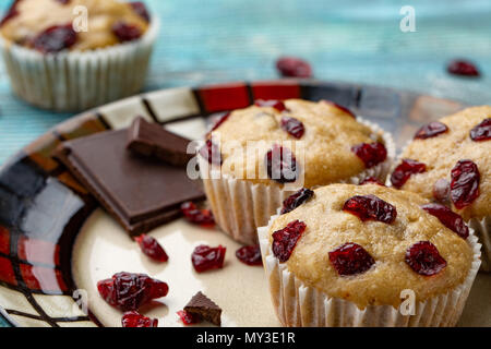 Platter of homemade vegan pumpkin muffins with chocolate and dried cherries. breakfast Stock Photo