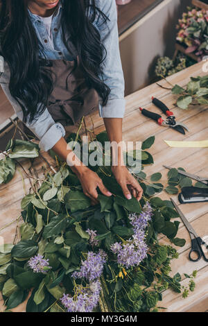 African American woman arranging flowers Stock Photo - Alamy