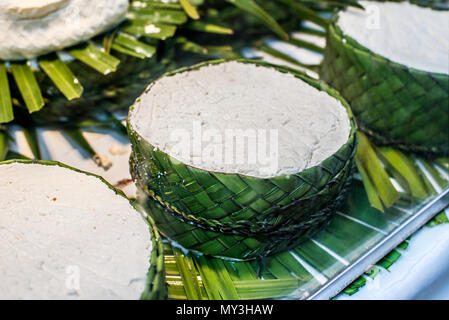 Jben, typical fresh cheese from the Rif mountain region in the north of Morocco, on a rustic presentation in a market storefront. Stock Photo