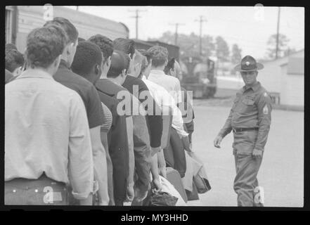 Draftees under the watchful eye of a Staff Sergeant wait in line to be processed into the U S Army at Fort Jackson, Columbia, South Carolina. Vietnam War Era. Stock Photo