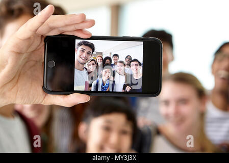 School friends posing together for selfie Stock Photo