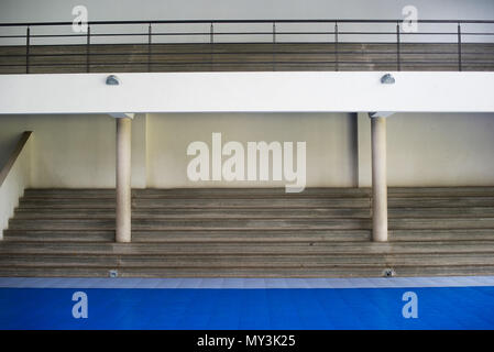 Bleachers in empty gymnasium Stock Photo