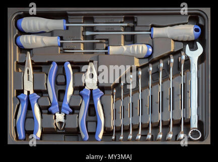 Set of old mechanic tool in box on black background. Top view. Flat lay. Stock Photo