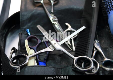 Various kinds of scissors and other hairdresser's tools Stock Photo