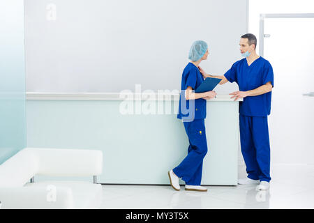 two surgeons discussing diagnosis in hospital Stock Photo