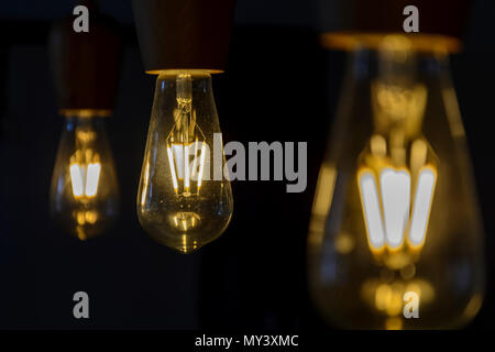 Vintage light bulb close up, lighting bulb in the dark Stock Photo