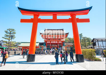 Red door named Torii in Fushimi Inari shrine, Kyoto, Japan Stock Photo