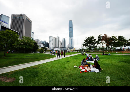 Filipina domestic helpers enjoying their Sunday day off in Tamar park in Hong Kong. Stock Photo