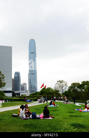 Filipina domestic helpers enjoying their Sunday day off in Tamar park in Hong Kong. Stock Photo