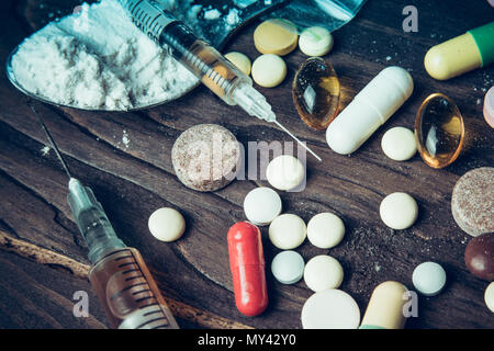 Drug concept. Use illicit Drug abuse .Addiction heroin.Injection, doping. Opium epidemic. Toning, selective focus. Stock Photo