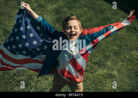 excited little boy with american flag, America's Independence Day concept Stock Photo