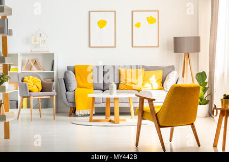 grey sofa yellow pillows