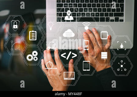 Coding software developer work with augmented reality dashboard computer icons of scrum agile development and code fork and versioning with responsive Stock Photo