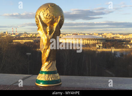 April 13, 2018 Moscow, Russia Trophy of the FIFA World Cup against the backdrop of the Luzhniki stadium in Moscow. Stock Photo