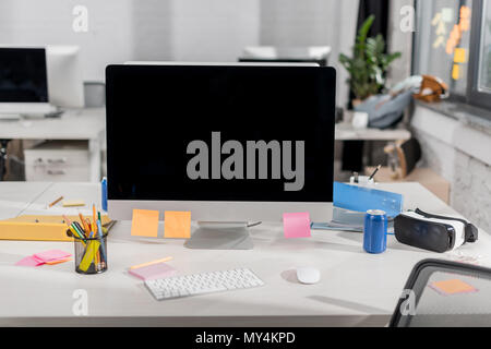 modern computer with blank screen at workplace in office Stock Photo