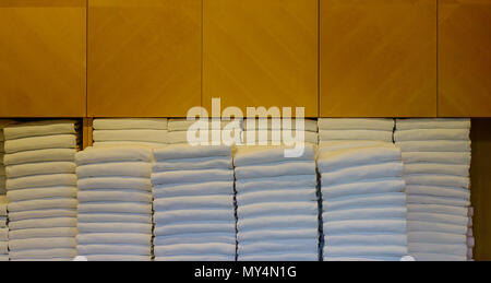 White towels in the wardrobe at luxury saunna spa. Stock Photo